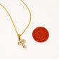 RAIMONA CROSS NECKLACE